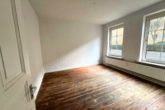 Wohnzimmer - Brunsbüttel | Gut vermietetes Mehrfamilienhaus mit 9 Einheiten in zentraler Lage von Brunsbüttel